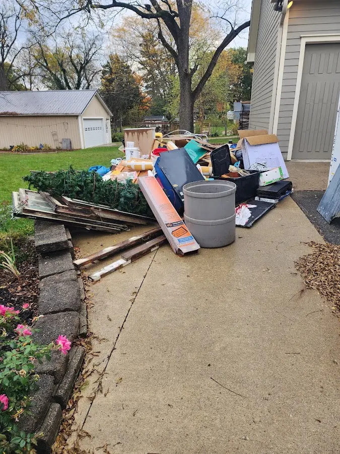 Dumpster being loaded with debris for 30 Yard Dumpster Rental in Shadyside